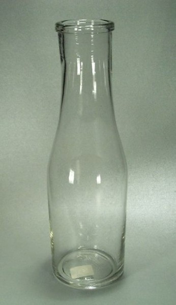 f041 / Alte Milchflasche, farbloses Glas.