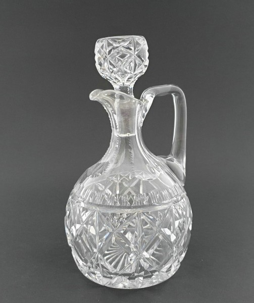 Glaskaraffe. Kristallglas, aufwendig geschliffen, um 1930.